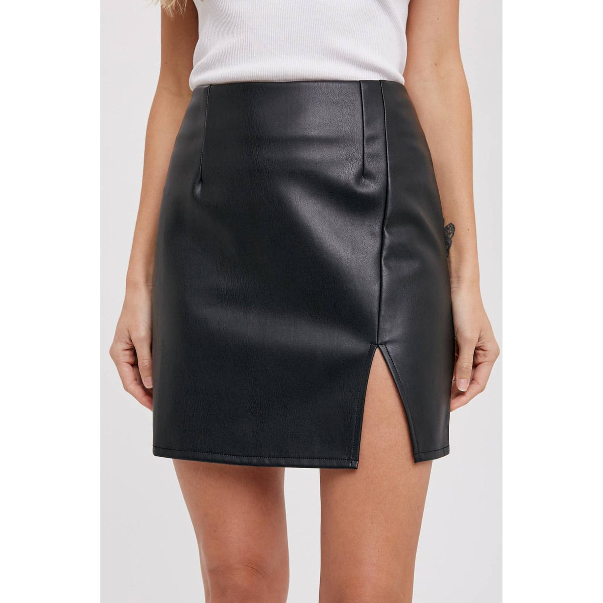 Black faux leather mini skirt with slit; womens clothing.