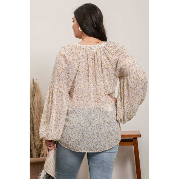 Long sleeved floral blouse; womens apparel.