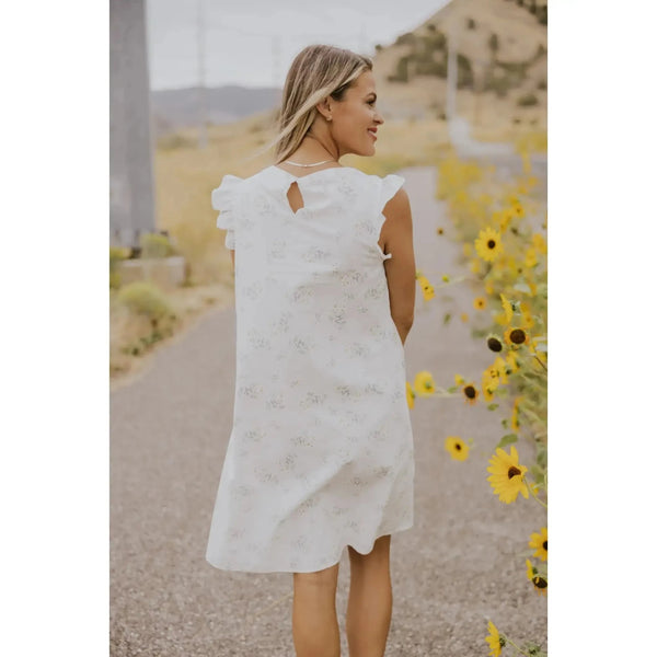 Dainty white dress with small floral design; womens clothing.