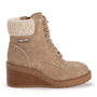 Tan ankle boot with shearling lining on a white background