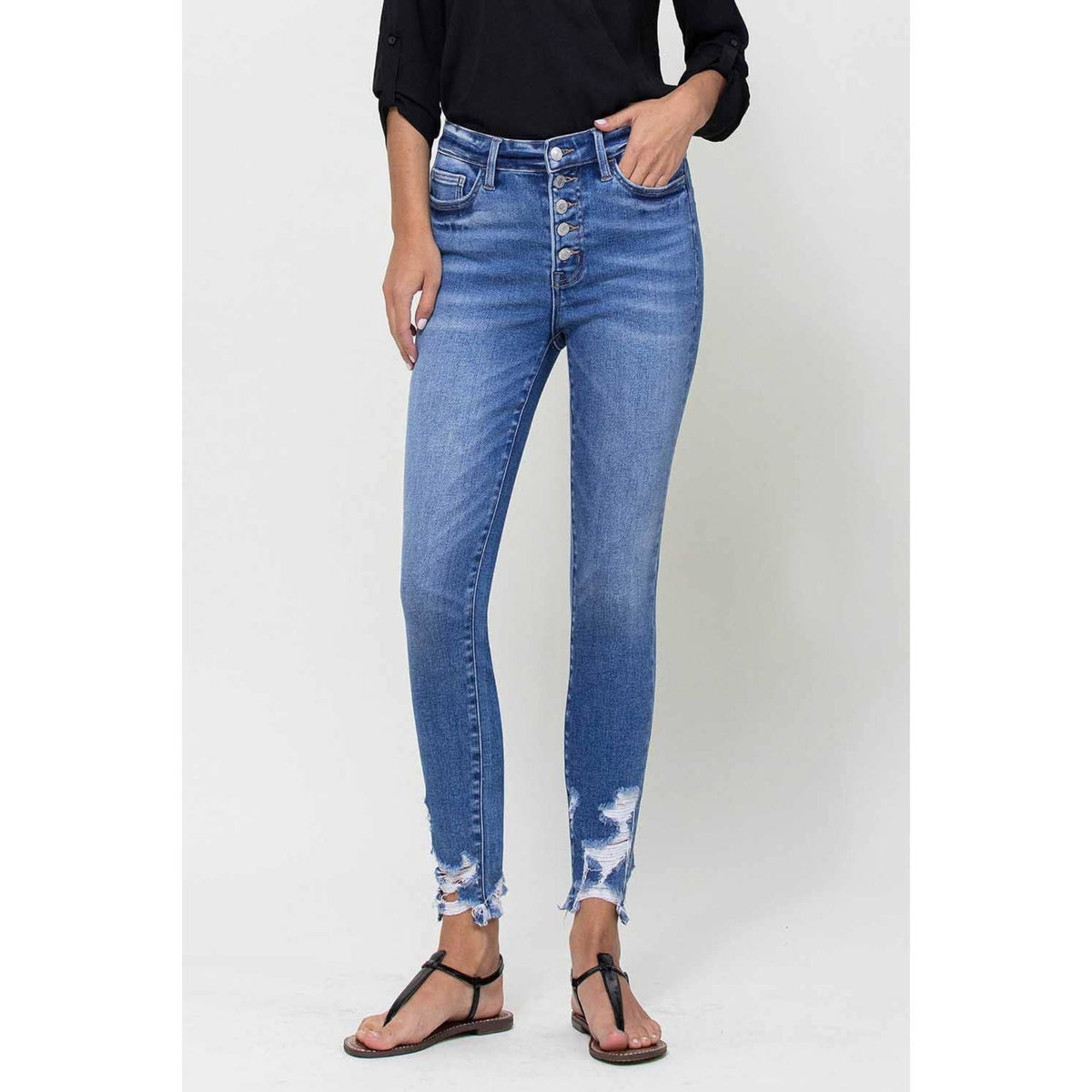 High rise buttoned dstressed bottom skinny jeans; womens clothing.