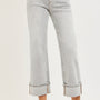 Light gray fold hem jeans worn by a person on a white background