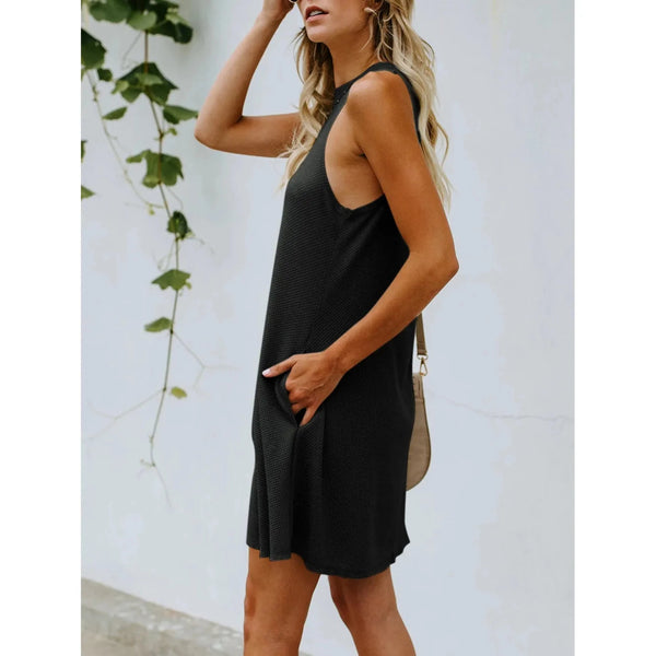 Black sleeveless knee length dress with cut-out back; womens clothing.