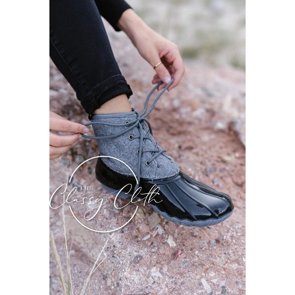 Grey and black laced up duck boots; womens shoes. 