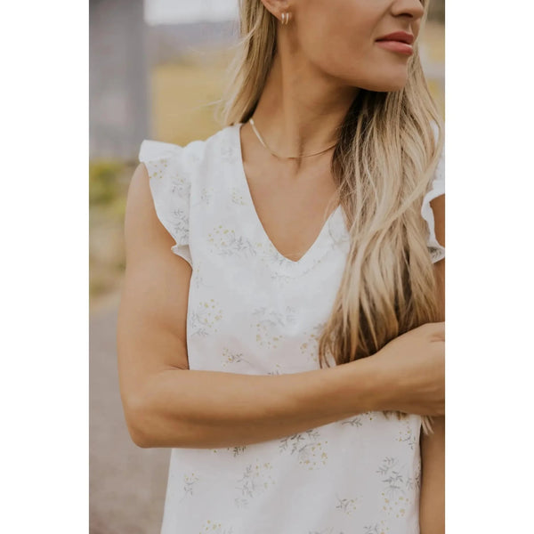 Dainty white dress with small floral design; womens clothing.