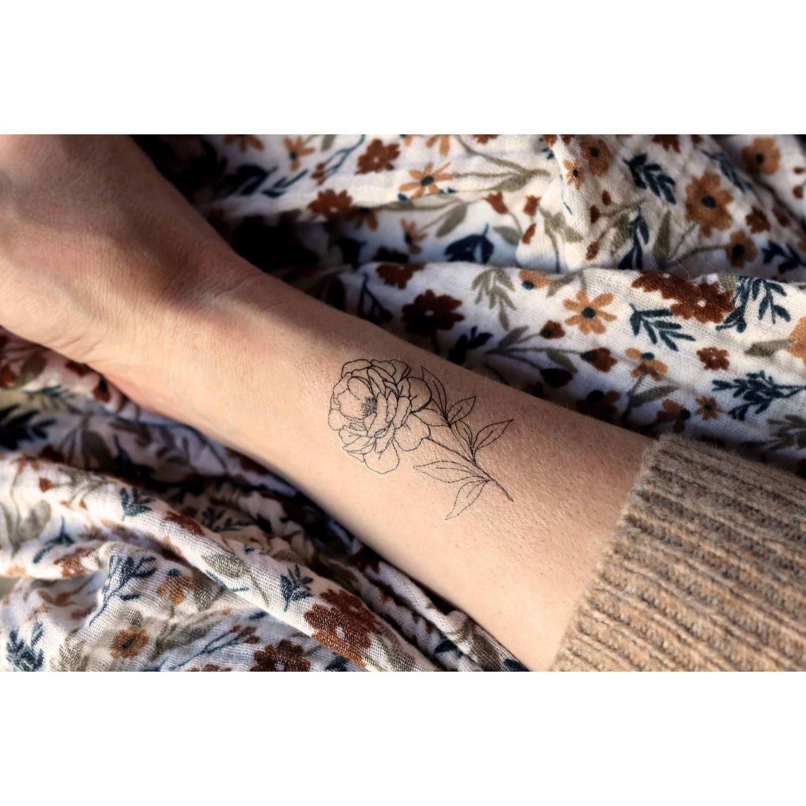 Small Peony Tattoo: A Delicate Birth Flower Statement