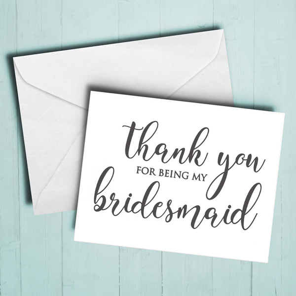 Simple white bridesmaid thank you card with black letters.