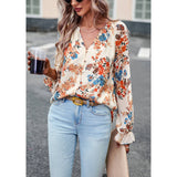 Floral button down long sleeve blouse; womens apparel.